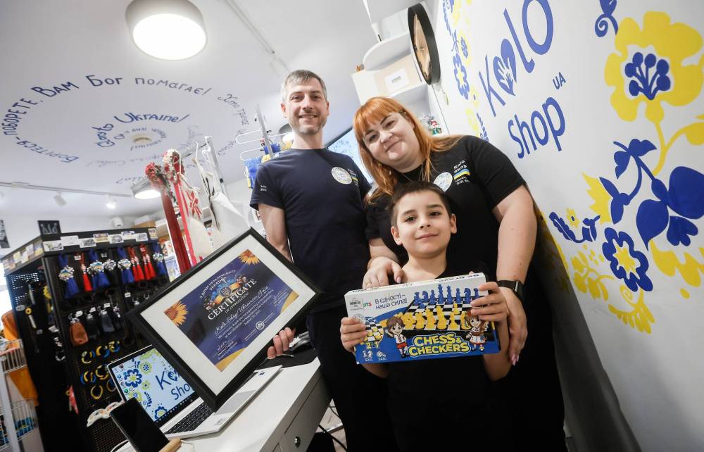 JOHN WOODS / FREE PRESS 
                                Serhii Okhrimenko, his wife Yuliia and their son Maksym (from left) are about to mark the first anniversary of their fledgling business.