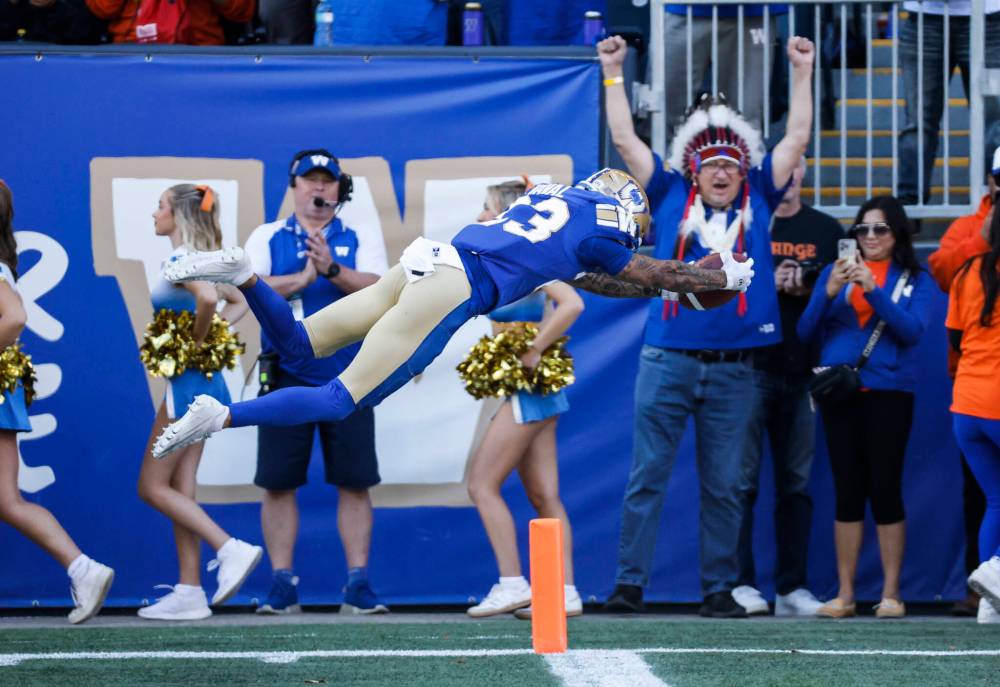 JOHN WOODS / THE CANADIAN PRESS
Winnipeg Blue Bombers’ Trey Vaval dives for a touchdown off the opening kickoff Saturday against the Hamilton Tiger-Cats. The Bombers beat down of the Ticats was, by far, their best performance of the season.