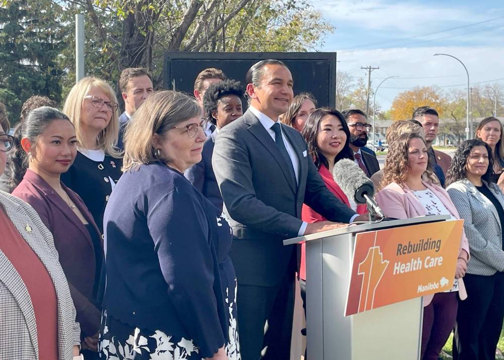 Ruth Bonneville / Free Press
Premier Wab Kinew, flanked by most members of the NDP caucus, told a news conference outside the hospital Friday that a contract to build the new ER is set to be awarded next month.
