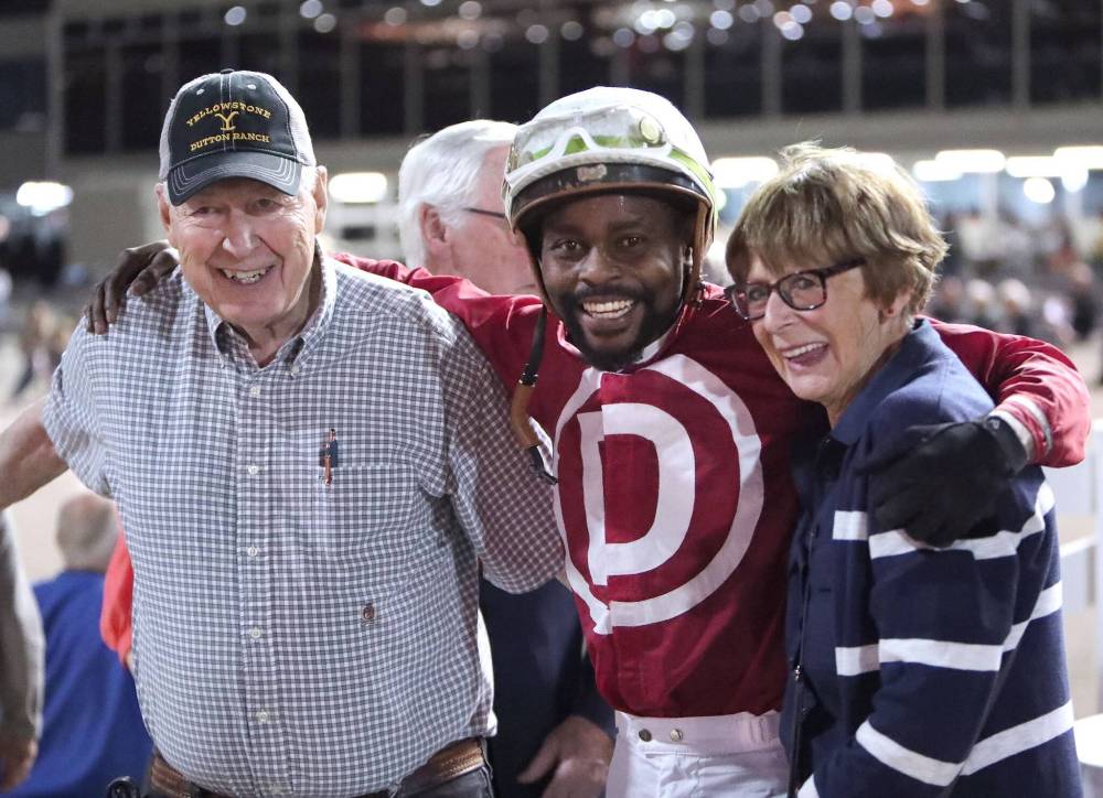 Jason Halstead / Assiniboia Photo
Owner Gary Danelson (left), jockey Antonio Whitehall (centre) and owner Bonnie McCrory celebrate in the winner’s circle after winning the Winnipeg Futurity with Omaha Warrior.