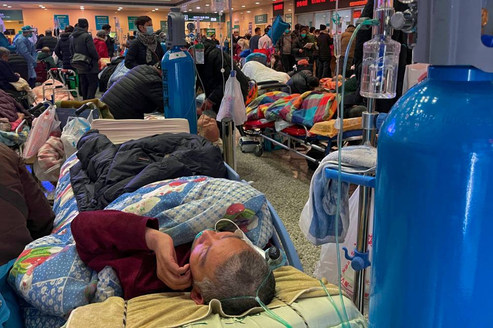 Associated Press files
In this 2023 photo, patients with COVID symptoms use ventilators at the crowded Changhai Hospital in Shanghai, China.