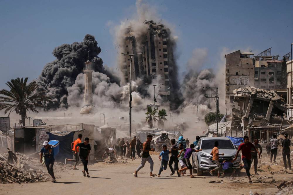 Yousef Al Zanoun / The Associated Press
A high-rise building is destroyed in Gaza City, Sept. 5.