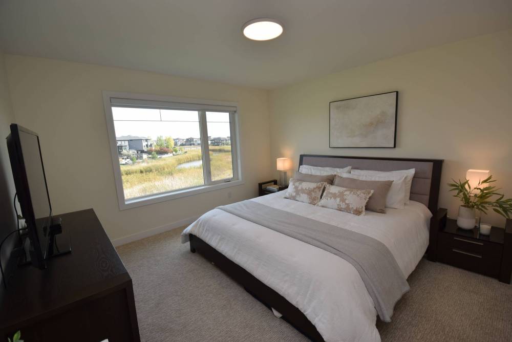 The primary bedroom is a private, peaceful retreat.
