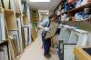 MIKE DEAL / FREE PRESS
                                Buhler Gallery curator hannah_g checks out some of the more than 400 artworks in storage at St. Boniface Hospital.