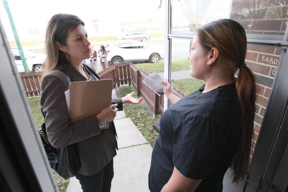 Then Point Douglas council candidate Chartrand talks with a neighbourhood resident. (Joe Bryksa / Free Press files)