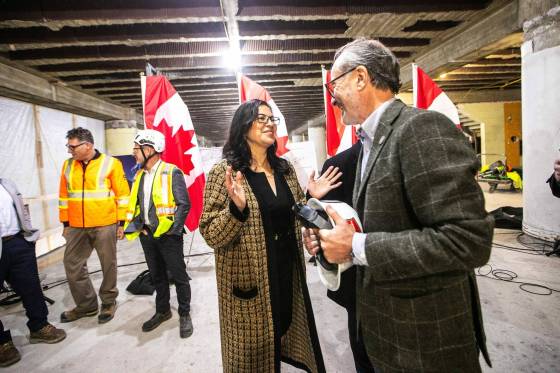 Minister of Northern and Arctic Affairs and Minister Responsible for the Canadian Northern Economic Development Agency Rebecca Chartrand chats with Jim Ludlow, president of True North Real Estate Development, at the under-construction Wehwehneh Bahgahkinahgohn building earlier this month. (Mikaela MacKenzie / Free Press)