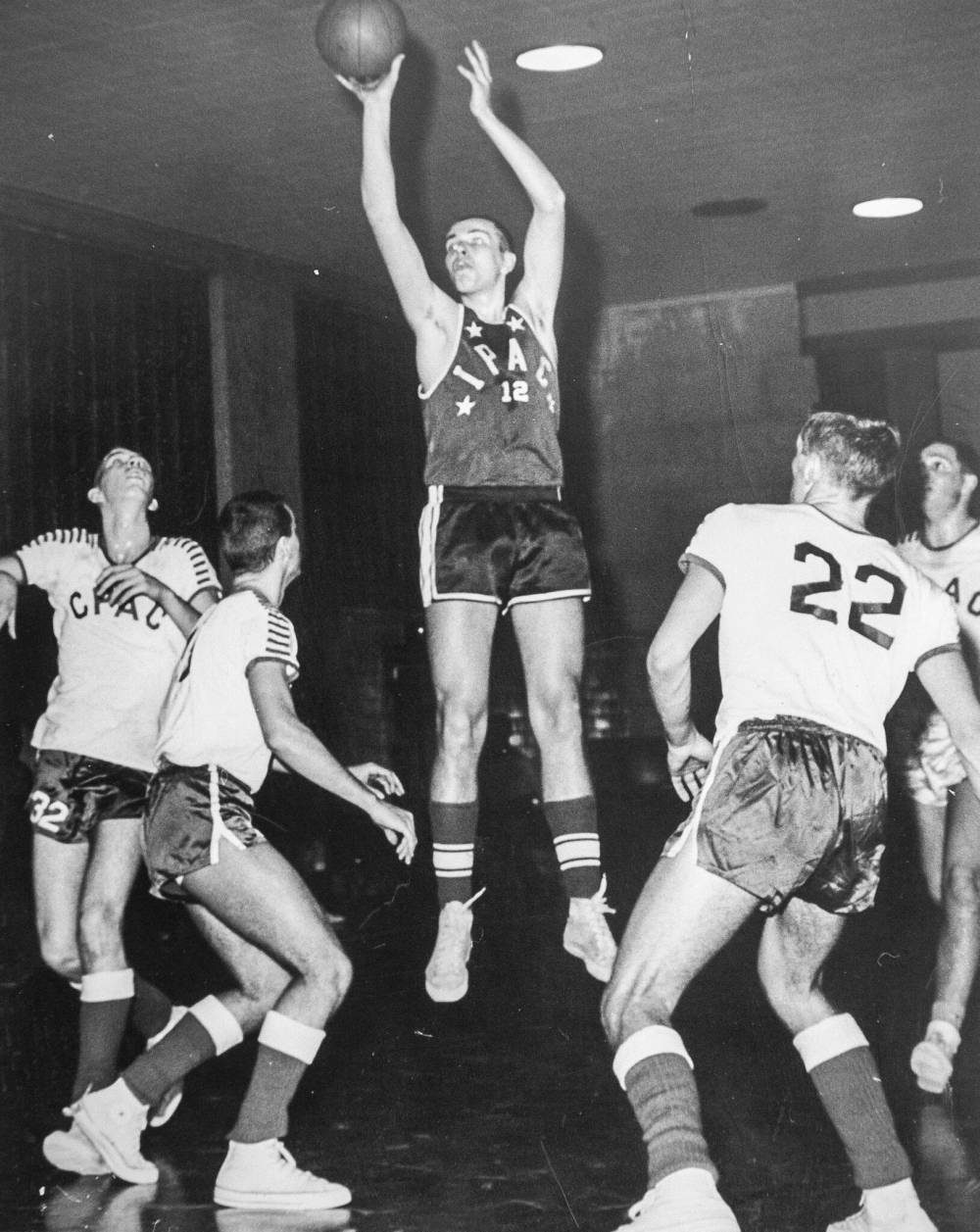 McLean (centre) was inducted into the Manitoba Basketball Hall of Fame in 1994.