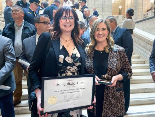 Ruth Bonneville / Free Press LOCAL - Order of the Buffalo Hunt Photo of Kristin Hayward, assistant deputy minister for the Manitoba Wildfire Service (left), and Christine Stevens, assistant deputy minister for the Manitoba Emergency Management Organization, hold the Order of the Buffalo Hunt awarded to them both by the Premier of Manitoba in a ceremony earlier for guiding the province through one of its most difficult wildfire seasons, at a special ceremony at the Legislative Building Thursday. They had their photo taken with a larger group of heroes who also were recognized for their emergency work helping with the Manitoba Wildfires this past summer. Hayward and Stevens, are two of Manitoba’s top emergency leaders that were recognized for guiding the province through one of its most difficult wildfire seasons in recent years. Oct 09, 2025
