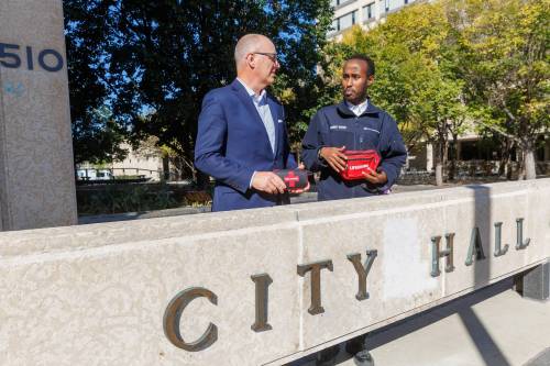 MIKE DEAL / FREE PRESS Mayor Scott Gillingham with security guard, Abdi Rahaman at City Hall. The Mayor administered naloxone with help from Abdi, on a person overdosing outside of his office at city hall Thursday. The Mayor says he has naloxone in his car and office. Reporter: Joyanne Pursaga 251010 - Friday, October 10, 2025.
