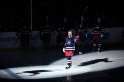 Bryan Little acknowledges the fans prior to the NHL game between the Winnipeg Jets and Pittsburgh Penguins in Winnipeg, Sunday, Oct. 20, 2024. In November 2019, Little suffered a career-ending injury. Little was signed to a one-day contract prior to Sunday’s game so he can officially retire from the NHL as a member of the Jets. THE CANADIAN PRESS/Fred Greenslade