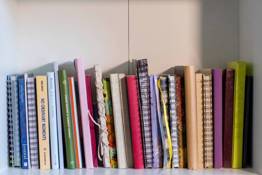BROOK JONES/FREE PRESS
A collection of just a fraction of Goodman’s journals lines a bookshelf in her Winnipeg home.