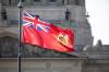 MIKAELA MACKENZIE / FREE PRESS FILES
                                The provincial flag flies in front of the Manitoba Legislative Building in August 2024.