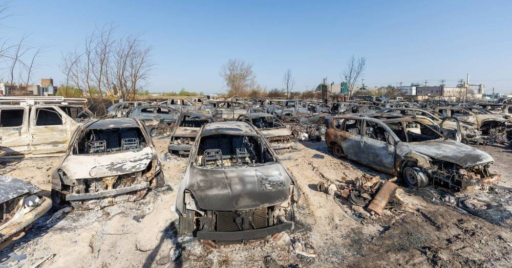 MIKE DEAL / FREE PRESS Hundreds of burnt out cars sit in a lot at 568 Gunn Road, destroyed by a grassfire that ravaged several businesses in North Transcona on Monday. Reporter: Nicole Buffie 250513 - Tuesday, May 13, 2025.