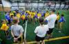 JOHN WOODS / FREE PRESS Coach Corey talks to new immigrant children at the beginning of a free try flag football session at the University of Winnipeg Sunday, October 12, 2025. Football Manitoba held two sessions Sunday.