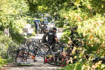 MIKAELA MACKENZIE / FREE PRESS FILES
                                Police used a warrant to search and seize goods from an encampment along Waterfront Drive in August.