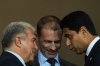 UEFA President Aleksander Ceferin, center, FC Barcelona president Joan Laporta, left, and PSG president Nasser Al-Khelaifi speak before the Champions League opening phase soccer match between Barcelona and Paris Saint-Germain at the Lluis Companys Olympic Stadium in Barcelona, Spain, Wednesday, Oct.1, 2025. (AP Photo/Emilio Morenatti)