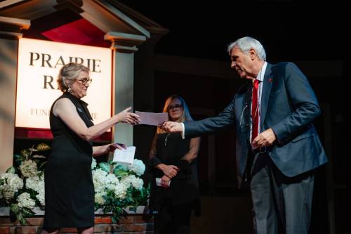 JOEY SENFT PHOTO 
                                Colin Jackson presents a donation to PTE artistic director Ann Hodges on Wednesday.