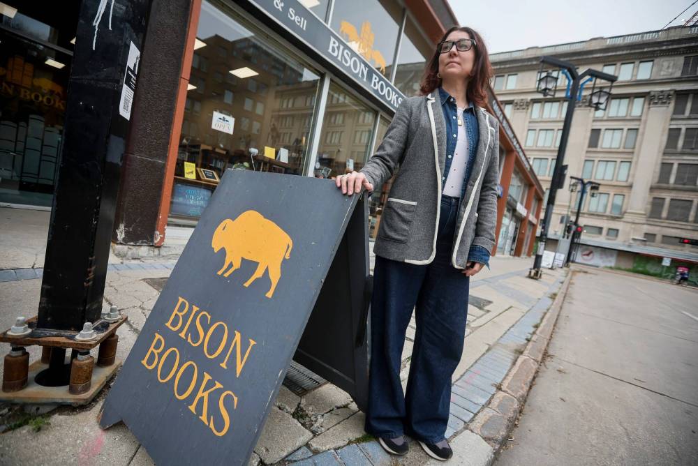 Aimee Peake, owner of Bison Books on Graham Avenue, which is seeing a major decline in foot traffic and sales due to the rerouting of buses. (John Woods / Free Press files)