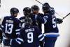 Winnipeg Jets' Gabriel Vilardi (13), Josh Morrissey (44), Alex Iafallo (9), Kyle Connor (81) celebrate Mark Scheifele's (55) goal against the Nashville Predators during first period NHL action in Winnipeg on Saturday, October 18, 2025. THE CANADIAN PRESS/John Woods