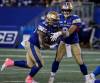 John Woods / THE CANADIAN PRESS
                                Winnipeg QB Zach Collaros (right) hands off to Brady Oliveira during the Bombers victory over the Saskatchewan Roughriders on Friday.