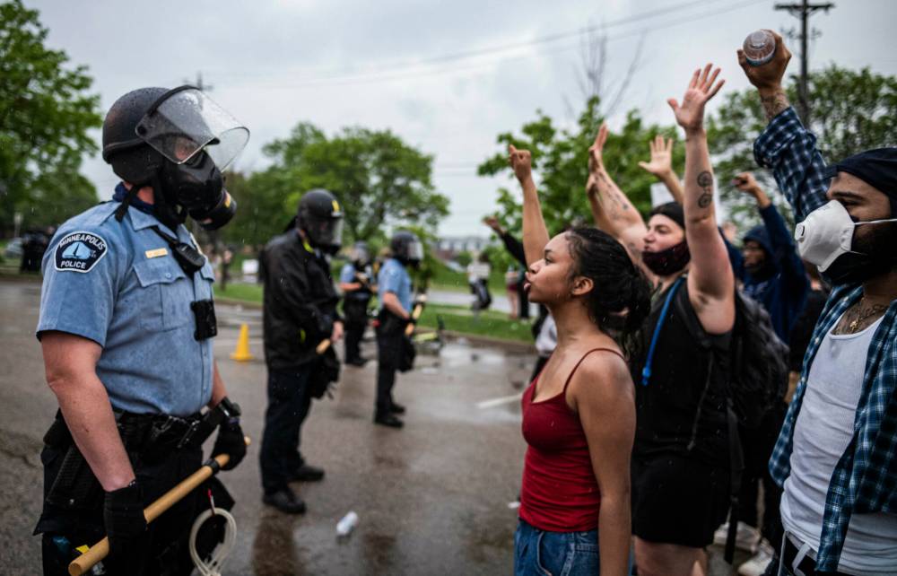 Richard Tsong-Taatarii / Associated Press files
                                Protesters and police face off during a rally in May 2020, after George Floyd’s death at the hands of law enforcement in Minneapolis.