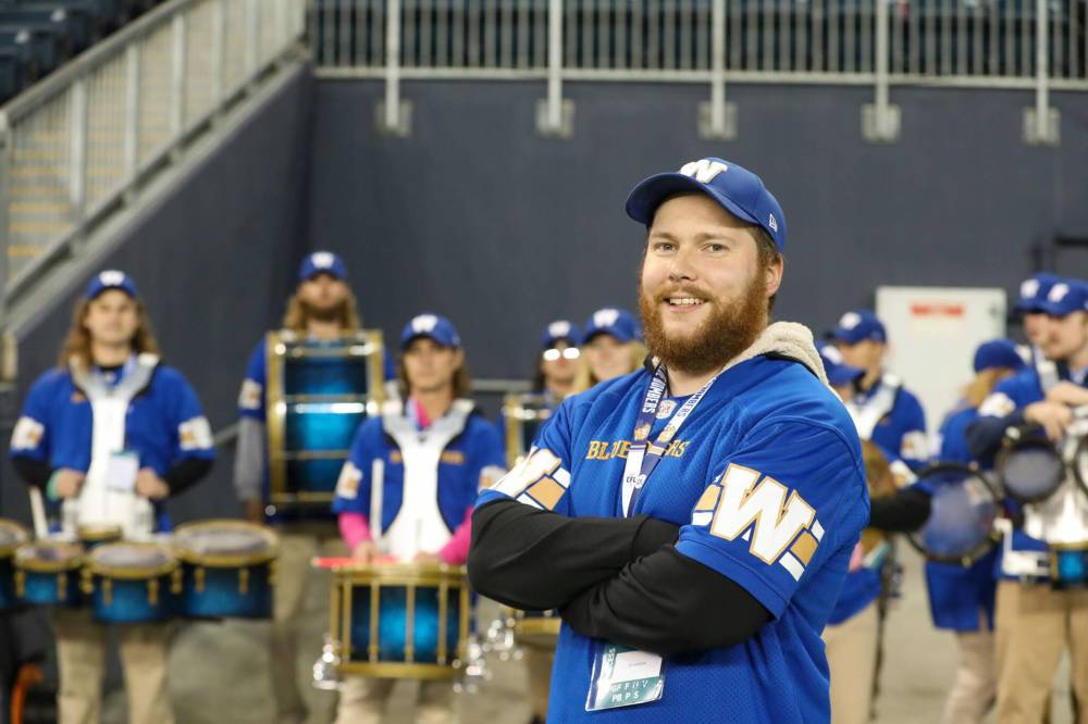Winnipeg school teacher Andrew Smith, the Blue Bombers’ drumline drum major, is convinced he’s got the best gig on the planet. (Brook Jones / Free Press)