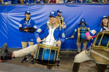 Blue Bombers drumline member Kaitlyn Childs, 23, has fun while playing a snare drum during the game between the Blue Bombers and visiting Saskatchewan Roughriders at Princess Auto Stadiumon Oct. 17. (Brook Jones / Free Press)