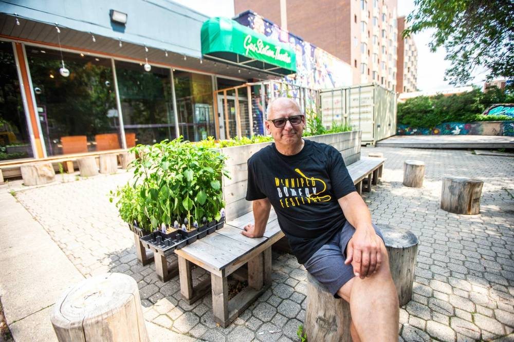 Gas Station Arts Centre executive director Nick Kowalchuk shows their existing courtyard area in 2024. (Mikaela MacKenzie / Free Press files)