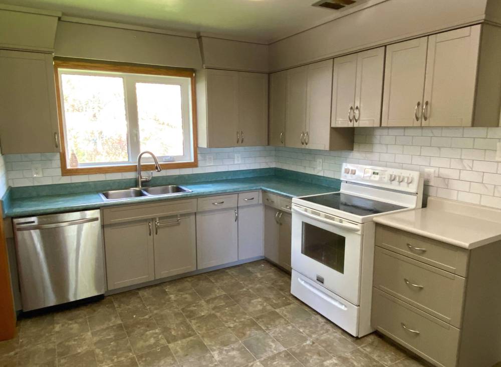 Marc LaBossiere / Free Press
                                A new peel-and-stick backsplash greatly improves a rental-property kitchen while adhering to a strict budget.