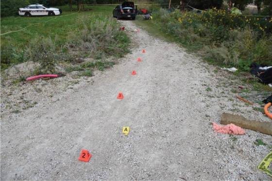 A photo in the IIU report shows evidence markers on the gravel road. (Supplied)