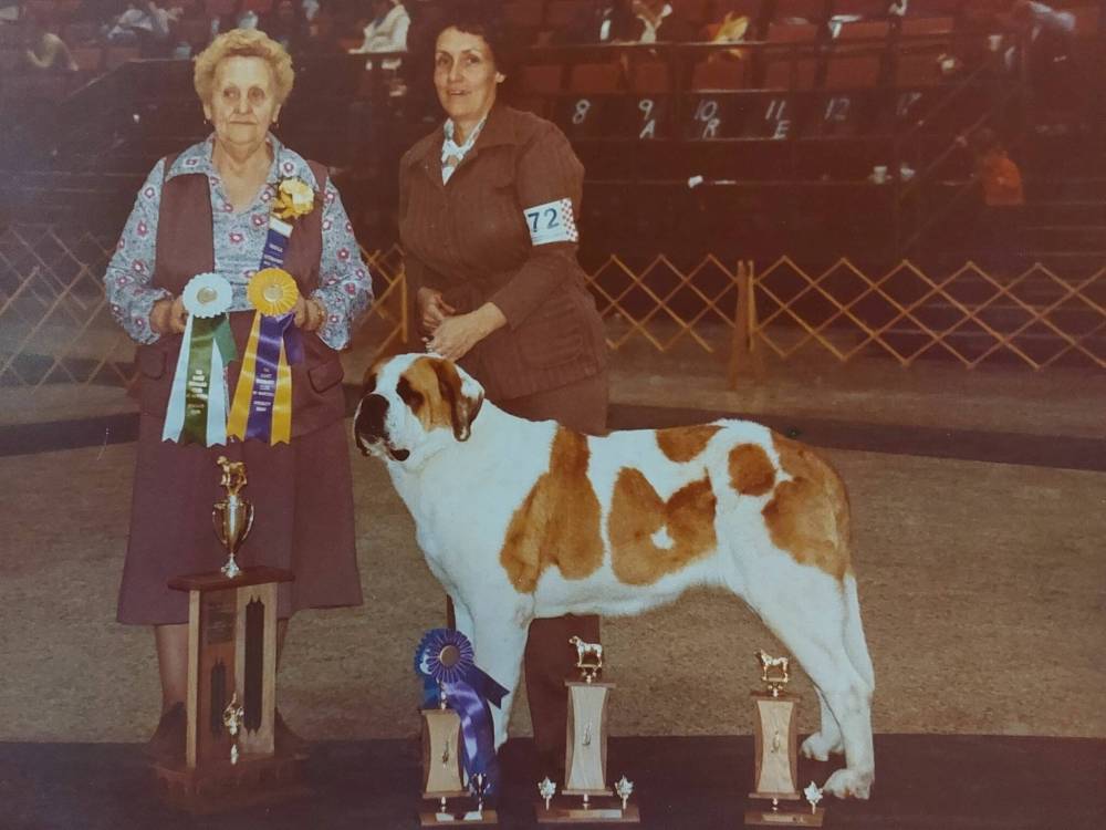 Pat and championship dog Déjà Vu in the winner’s circle at a dog show.