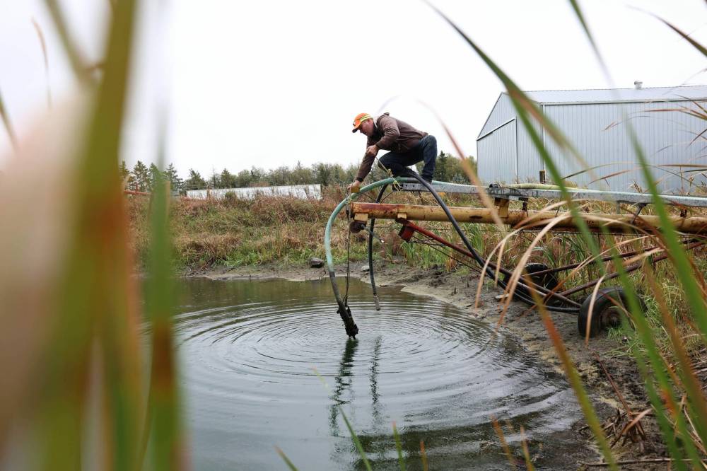 Penner tackles his end-of-season to-do list while waiting for drier conditions to finish up field work. (Ruth Bonneville / Free Press)
