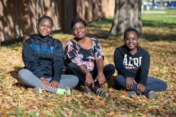 Funmilayo Adewusi (centre) says New Journey Housing helped make getting settled in Canada easier for her and her daughters Awesome, 9, (left) and Racheal, 13. (Brook Jones / Free Press)