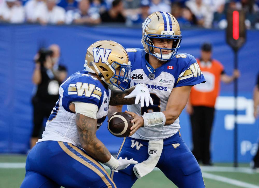 John Woods / THE CANADIAN PRESS files
                                Winnipeg Blue Bombers quarterback Zach Collaros (right) and running back Brady Oliveira will watch the club’s season finale against the Montreal Alouettes from the sideline.
