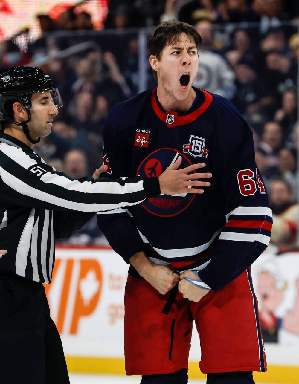 JOHN WOODS / THE CANADIAN PRESS
                                Logan Stanley dropped the gloves with the Flames’ Adam Klapka, who is an inch taller than the Jets’ towering blue-liner.