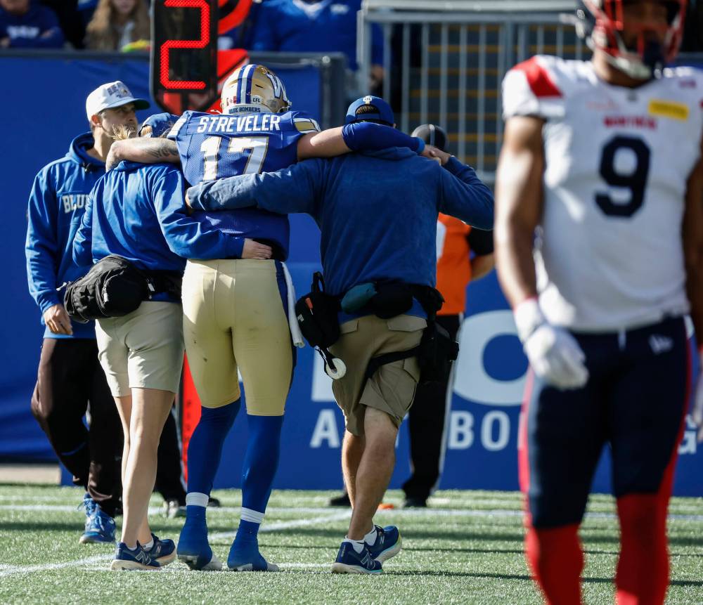 JOHN WOODS / THE CANADIAN PRESS
Winnipeg Blue Bombers quarterback Chris Streveler (17) gets sacked and goes off with an injury during first half CFL action against the Montreal Alouettes in Winnipeg, Saturday, Oct. 25, 2025.