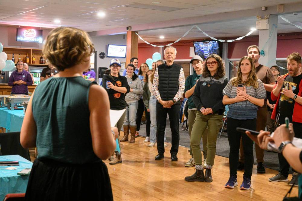 MIKE SUDOMA/WINNIPEG FREE PRESS Candidate Emma Durant-Wood smiles with joy after being announced as the new Elmwood-East Kildonan councilor Saturday night at the Elmwood Curling Club.