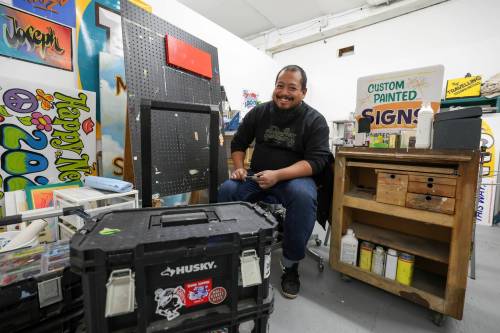 Ruth Bonneville / Free Press
                                Joseph Pilapil’s meticulously formed letters, from bold block capitals to curly twirls and swirls, appear in front of restaurants, on shop windows and sandwich panels.