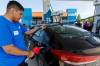 MIKE DEAL / FREE PRESS FILES
                                Roman McDougall at the pump for a customer shortly after the Grand Opening ceremonies of Oodena Gas & Convenience —Treaty One’s first retail venture and the inaugural business launch at Naawi-Oodena, Friday morning.