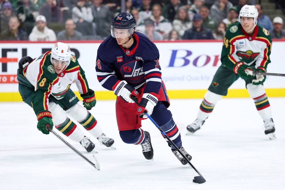 Matt Krohn / The Associated Press
                                Winnipeg Jets right winger Gustav Nyquist evades Minnesota Wild defenceman Zeev Buium in the second period.