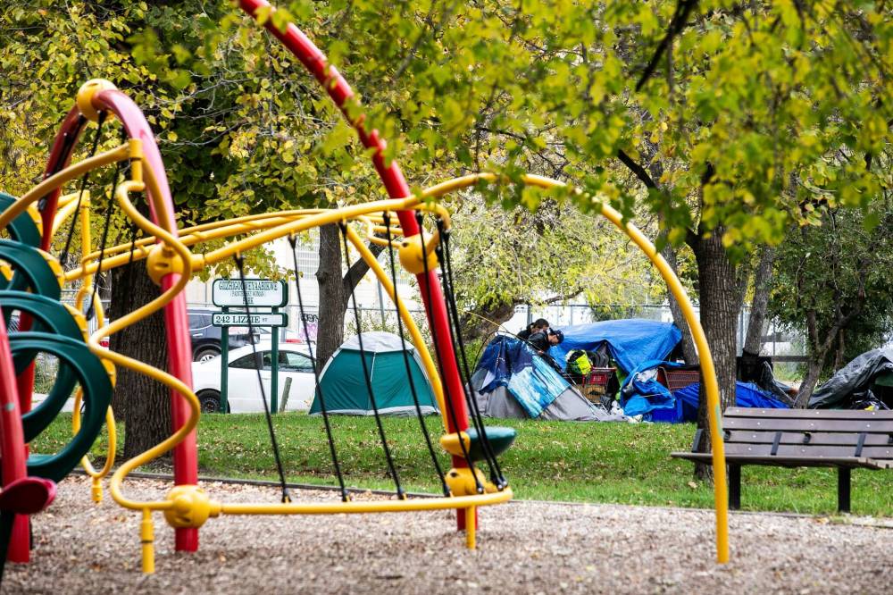 MIKAELA MACKENZIE / FREE PRESS FILES
                                An encampment by a playground at Alexander Avenue and Lizzie Street.