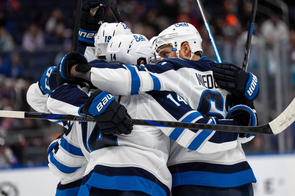 ANGELINA KATSANIS / THE ASSOCIATED PRESS FILES
                                The Winnipeg Jets have opened the season with a flattering 7-3 record. Forward Nino Niederreiter (right) said the club is still looking to improve, and thinks the team will feel better when they “find a way to pull a full 60 minutes together.”