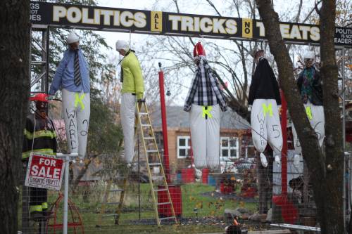 MATTHEW FRANK / THE CARILLON
                                Five life-size dolls hang from nooses on a Ste-Genevieve property on Thursday, Oct. 30.
