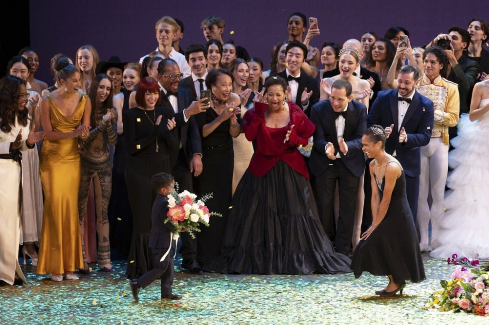 Dancer Misty Copeland, right, takes a bow during curtain calls with her son, Jackson, at her retirement performance from American Ballet Theatre at the David H. Koch Theater at Lincoln Center, Wednesday, Oct. 22, 2025, in New York. (Rosalie O'Connor via AP)