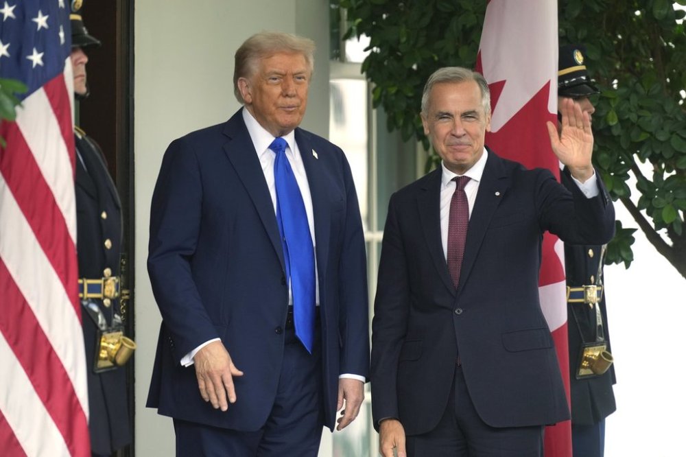U.S. President Donald Trump welcomes Prime Minister Mark Carney to the White House in Washington, D.C., Tuesday, Oct. 7, 2025. THE CANADIAN PRESS/Adrian Wyld