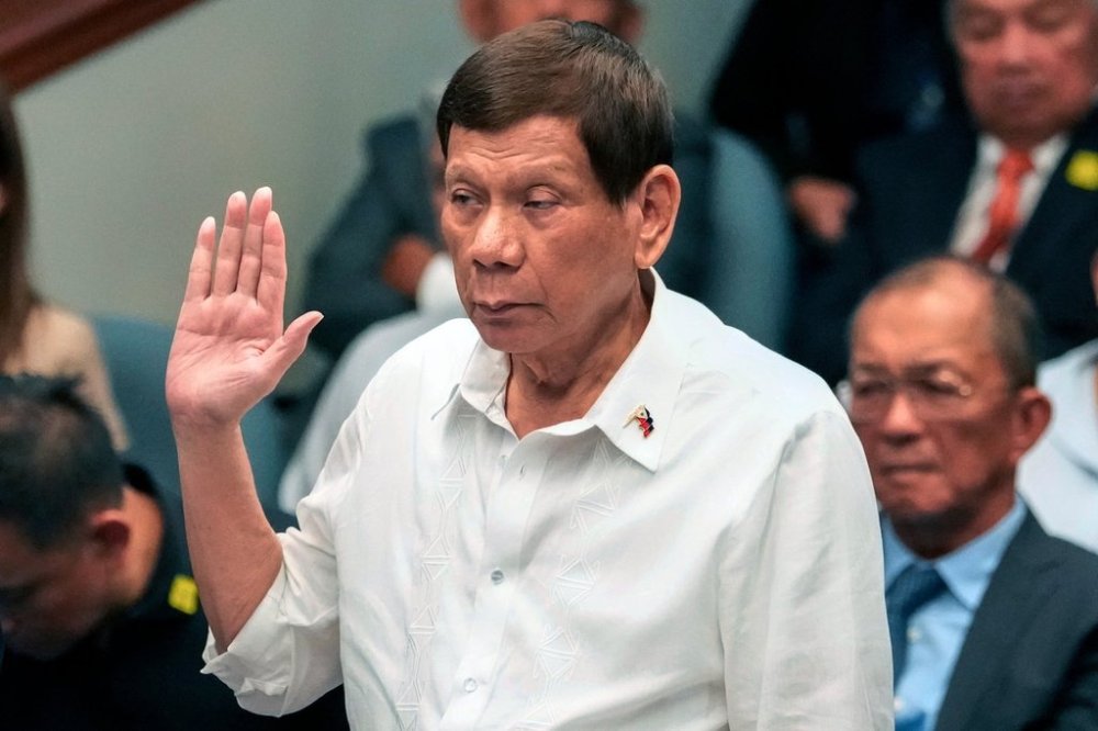 FILE - Former Philippine President Rodrigo Duterte takes oath during a senate inquiry on the so-called war on drugs during his administration at the Philippine Senate, on Oct. 28, 2024, in Manila, Philippines. (AP Photo/Aaron Favila, File)
