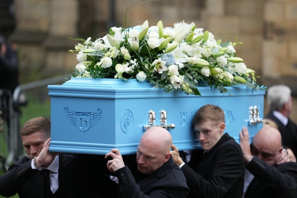 Family members carry the coffin of boxer Ricky Hatton out of Manchester Cathedral following his funeral in Manchester, England, Friday, Oct. 10, 2025. (AP Photo/Jon Super)
