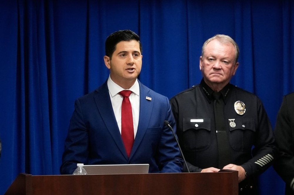 Acting U.S. Attorney Bill Essayli, left, speaks next to Los Angeles Police Chief Jim McDonnell during a news conference announcing an arrest made in the Palisades Fire, Wednesday, Oct. 8, 2025, in Los Angeles. (AP Photo/Damian Dovarganes)