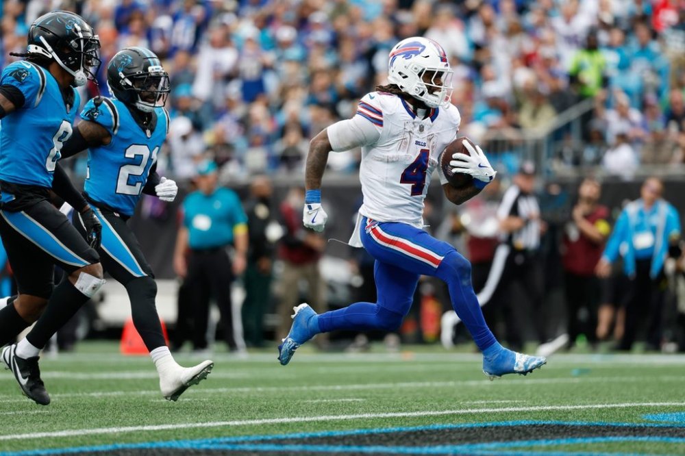 Buffalo Bills running back James Cook III (4) runs into the endzone for a touchdown against the Carolina Panthers during the second half an NFL football game, Sunday, Oct. 26, 2025, in Charlotte, N.C. (AP Photo/Rusty Jones)