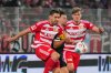 Berlin's Rani Khedira, left, and Aljoscha Kemlein challenge Freiburg's Lucas Höler during the Bundesliga soccer match between FC Union Berlin and SC Freiburg in Berlin, Saturday Nov. 1, 2025. (Soeren Stache/dpa via AP)